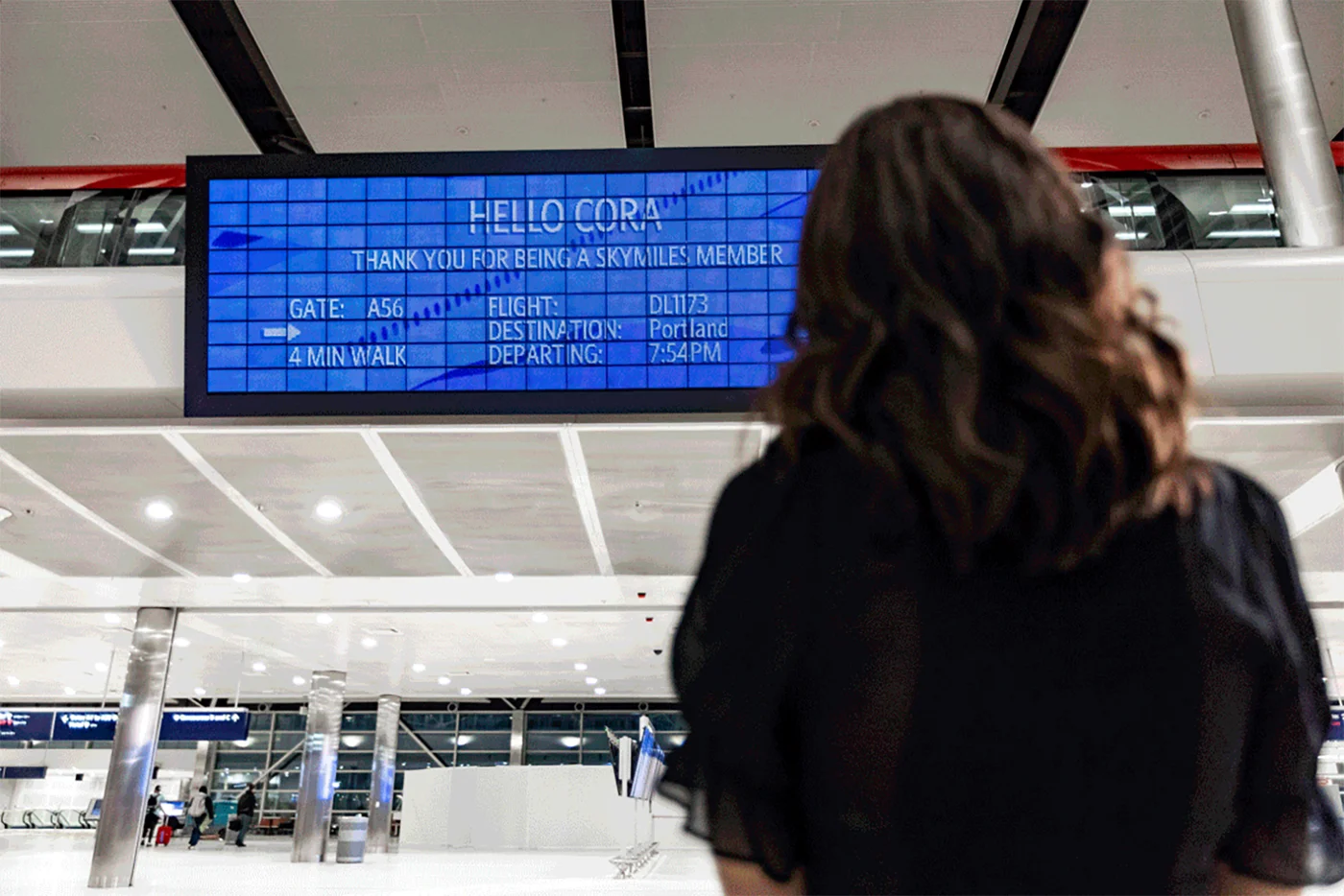 Parallel Reality™ display at DTW Airport. Obtained from
Baskas2022. Passengers opt in, and then motion sensors in ceiling
track them around. The display can serve up to 100 people in a
designated viewing area. Everyone else gets generic info.